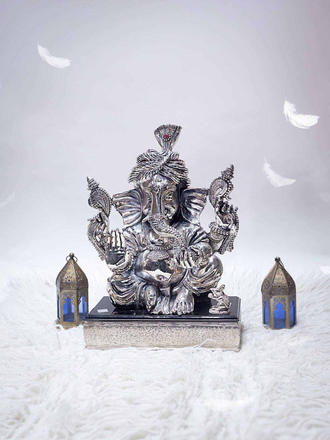 Silver Ganesh Ji With Pagdi Sitting on Black Marble