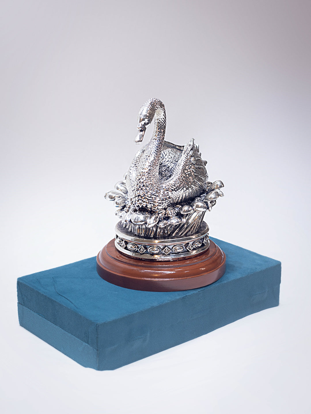 Silver Duck Sitting on Flower