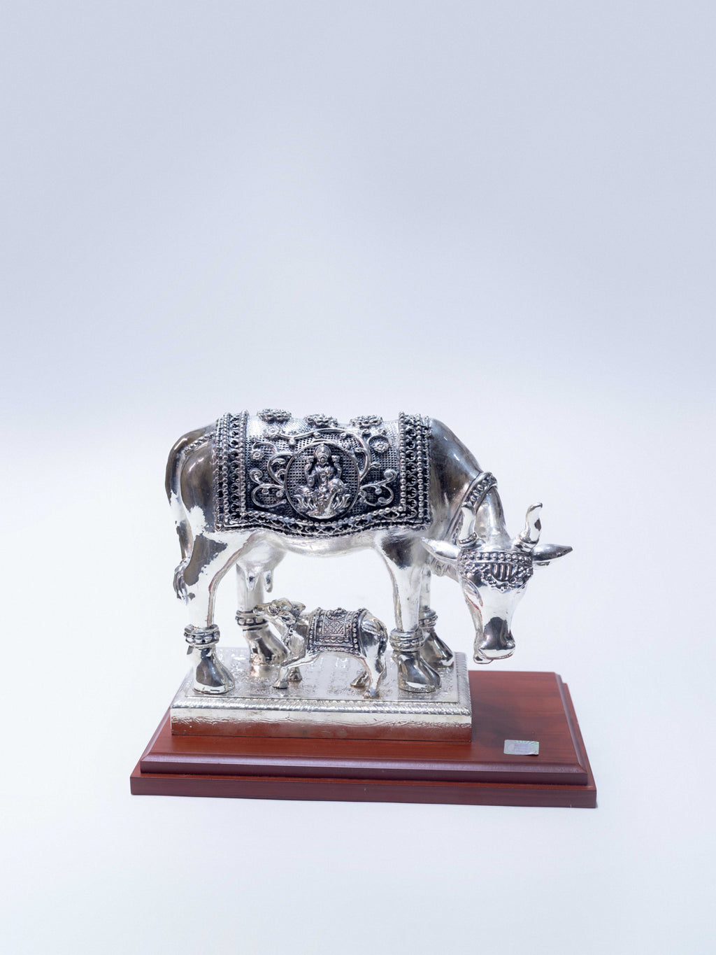 Silver Cow With Goddess Laxmi Engraved on The Cow