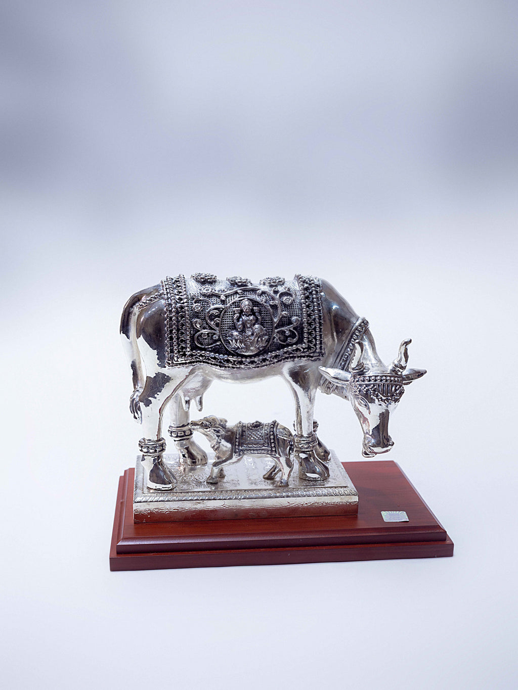 Silver Cow With Goddess Laxmi Engraved on The Cow