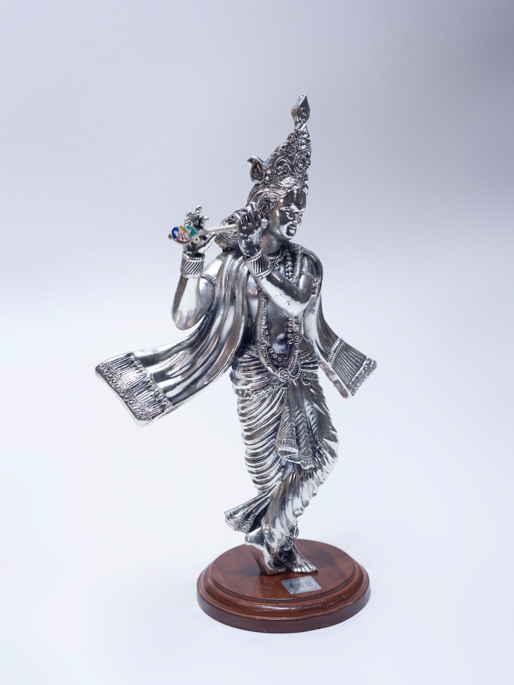 Silver Krishna Ji Playing Bansuri on a Wooden Base