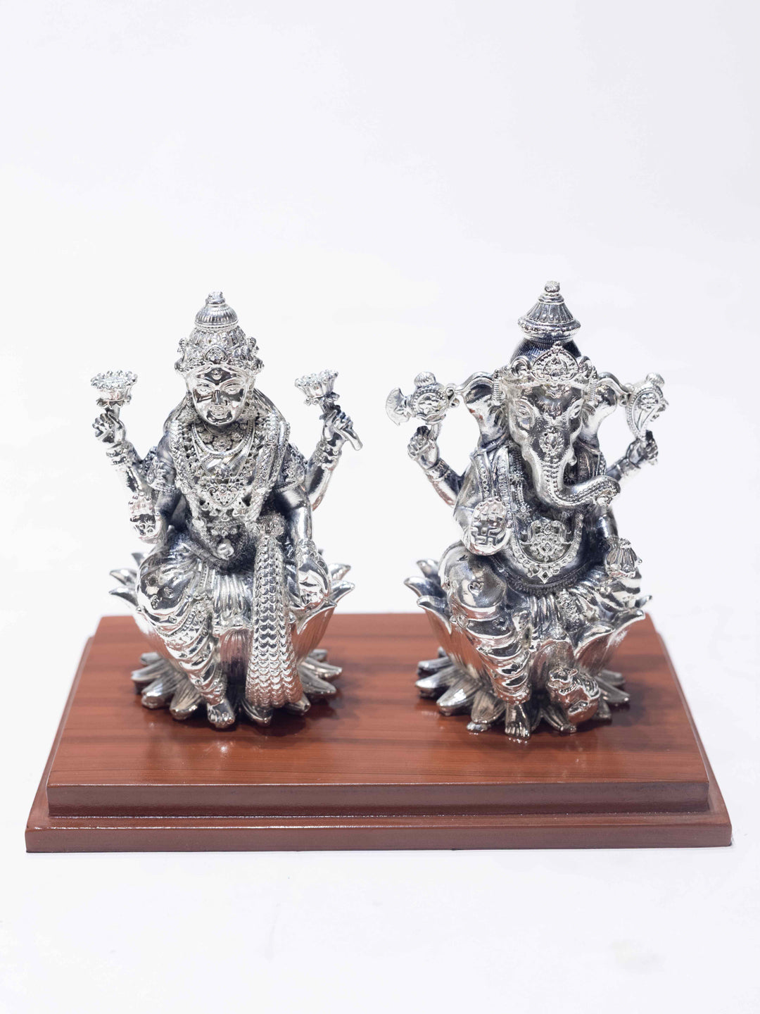 Silver Laxmi Ganesh Sitting on Wooden Base (With Acrylic Box)