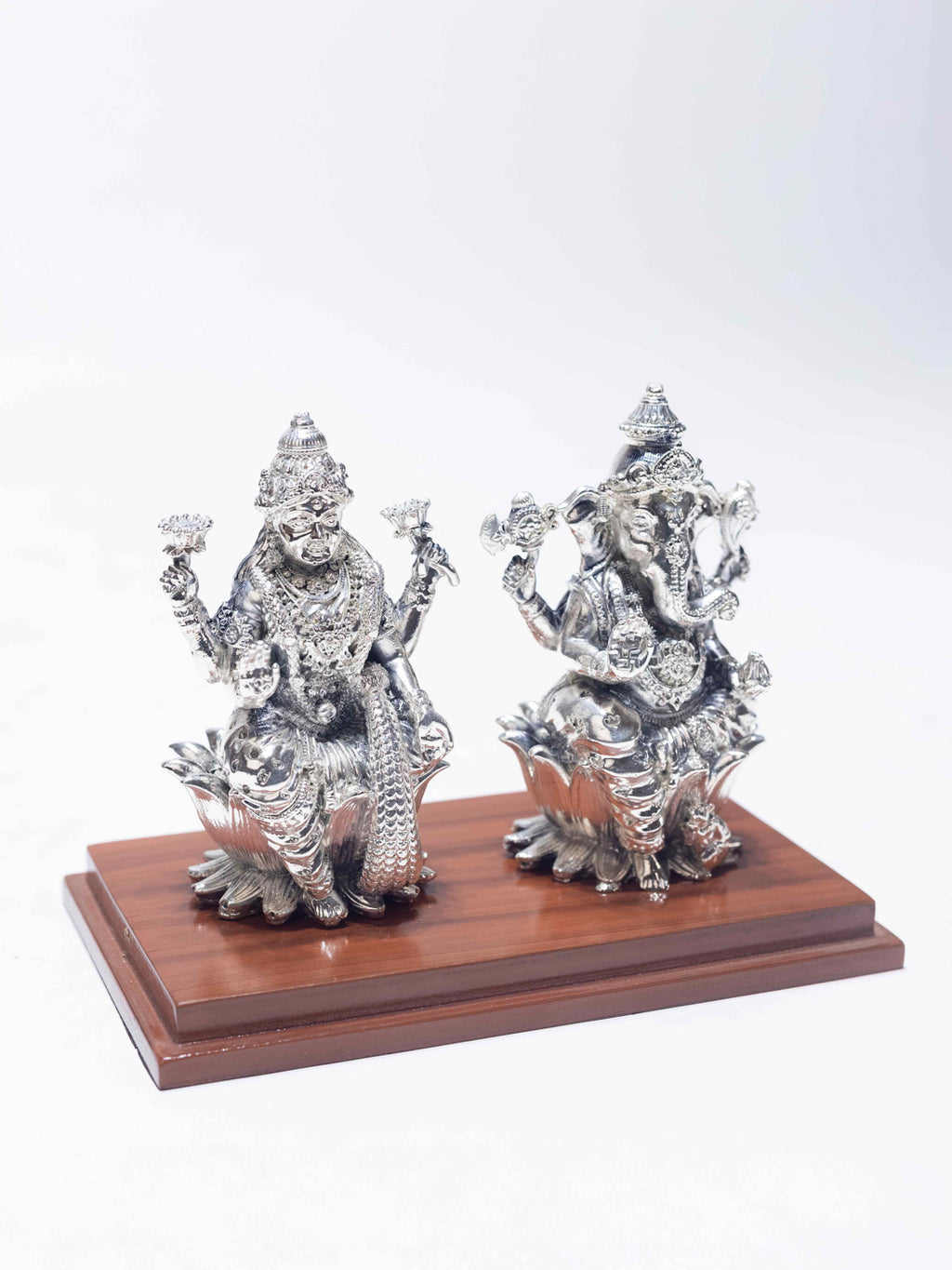Silver Laxmi Ganesh Sitting on Wooden Base (With Acrylic Box)